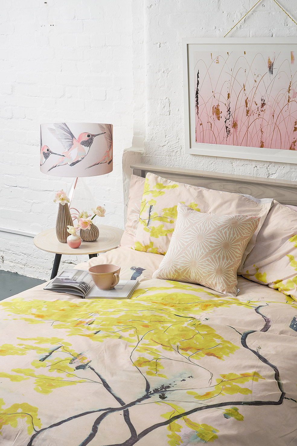 Anna Jacobs Chinese Tree in Blush bed linen in a lifestyle setting with Afternoon Dreaming print on the wall, Beak Street in Rose cushion and Rose Hummer lamp on Rose flex