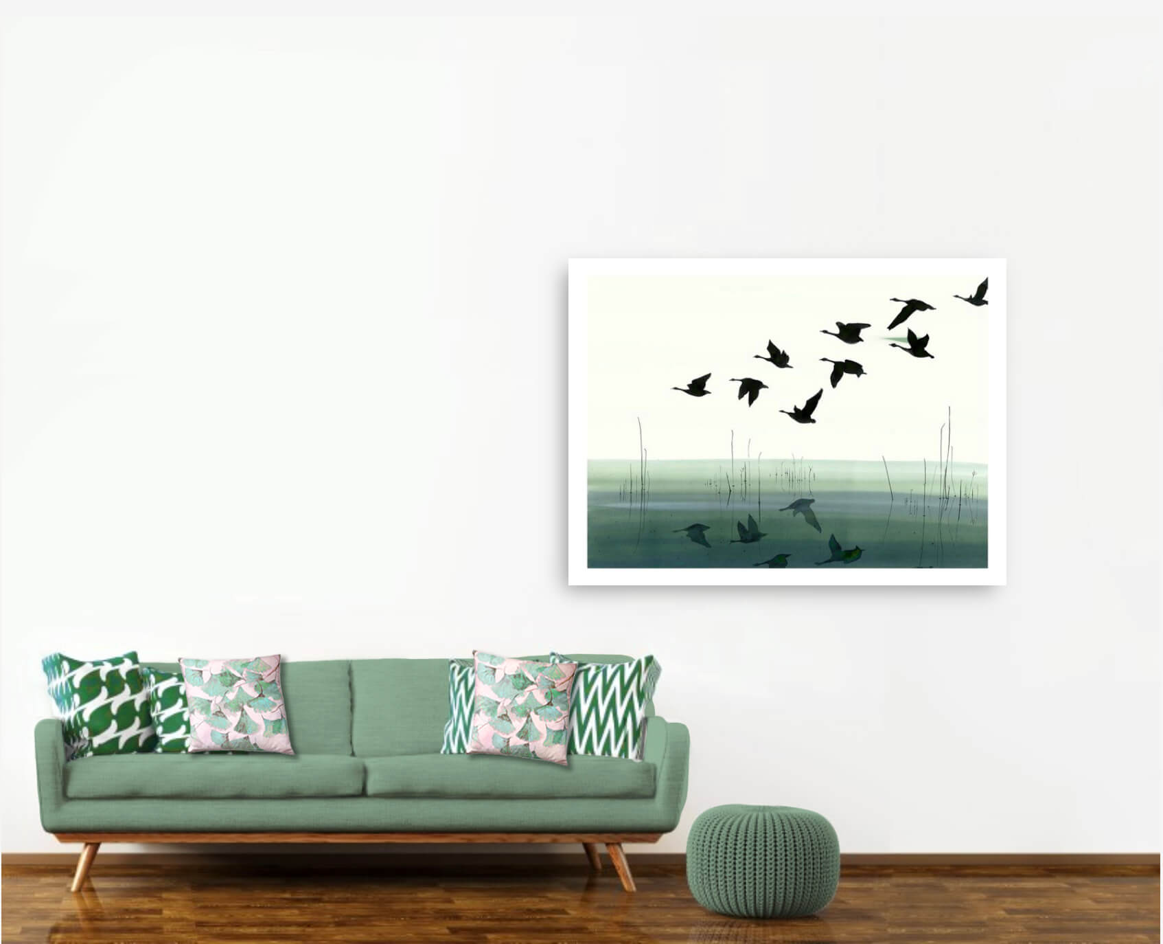 Welsh Reflection print on wall beside green sofa with Ginkgo in Jade velvet cushions