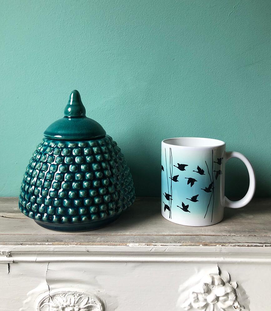 Flying Geese mug in Jade, by Anna Jacobs - lifestyle