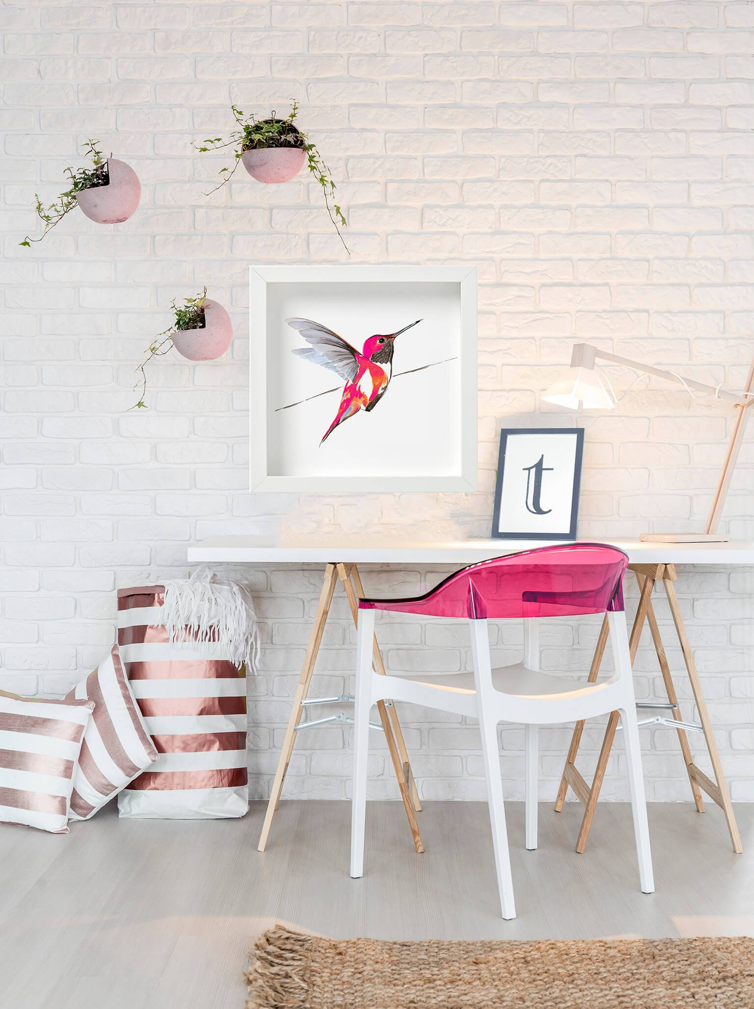 large framed pink hummingbird print,  by Anna Jacobs, on wall behind desk