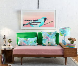 Anna Jacobs Falling leaves in Summer linen bolster lifestyle on sofa with lamp and a Moment to Reflect print